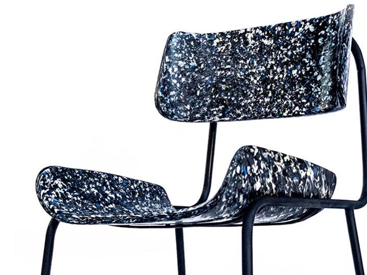 A modern-styled chair made from multi-color recycled plastic